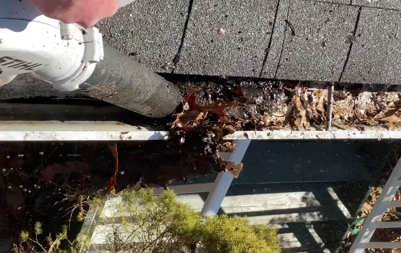Gutter clogged with debris before a seasonal cleaning visit in Anderson, SC